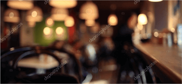 Blurred interior of cozy cafe with patrons