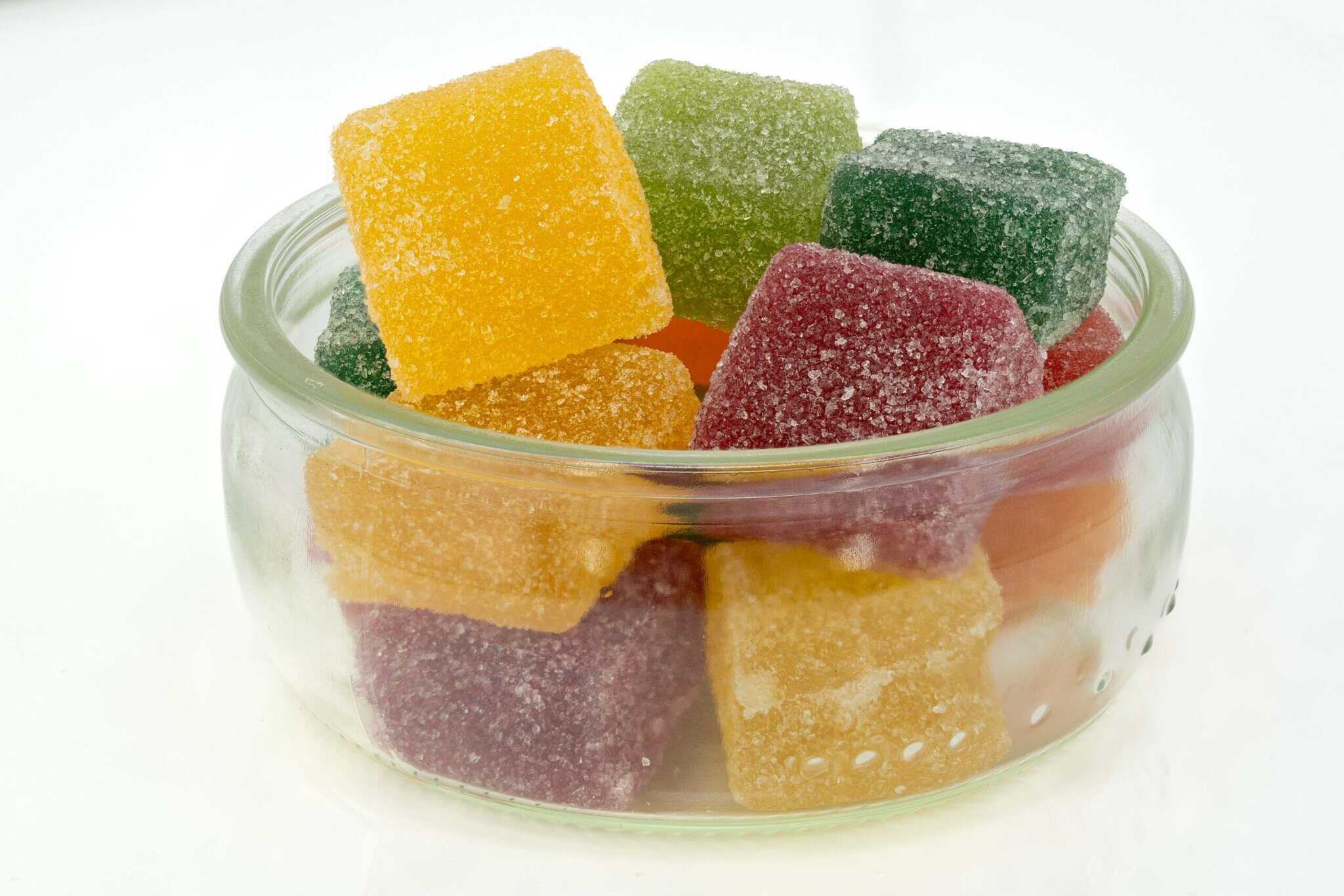 Colorful sugar-coated jellies in glass bowl.